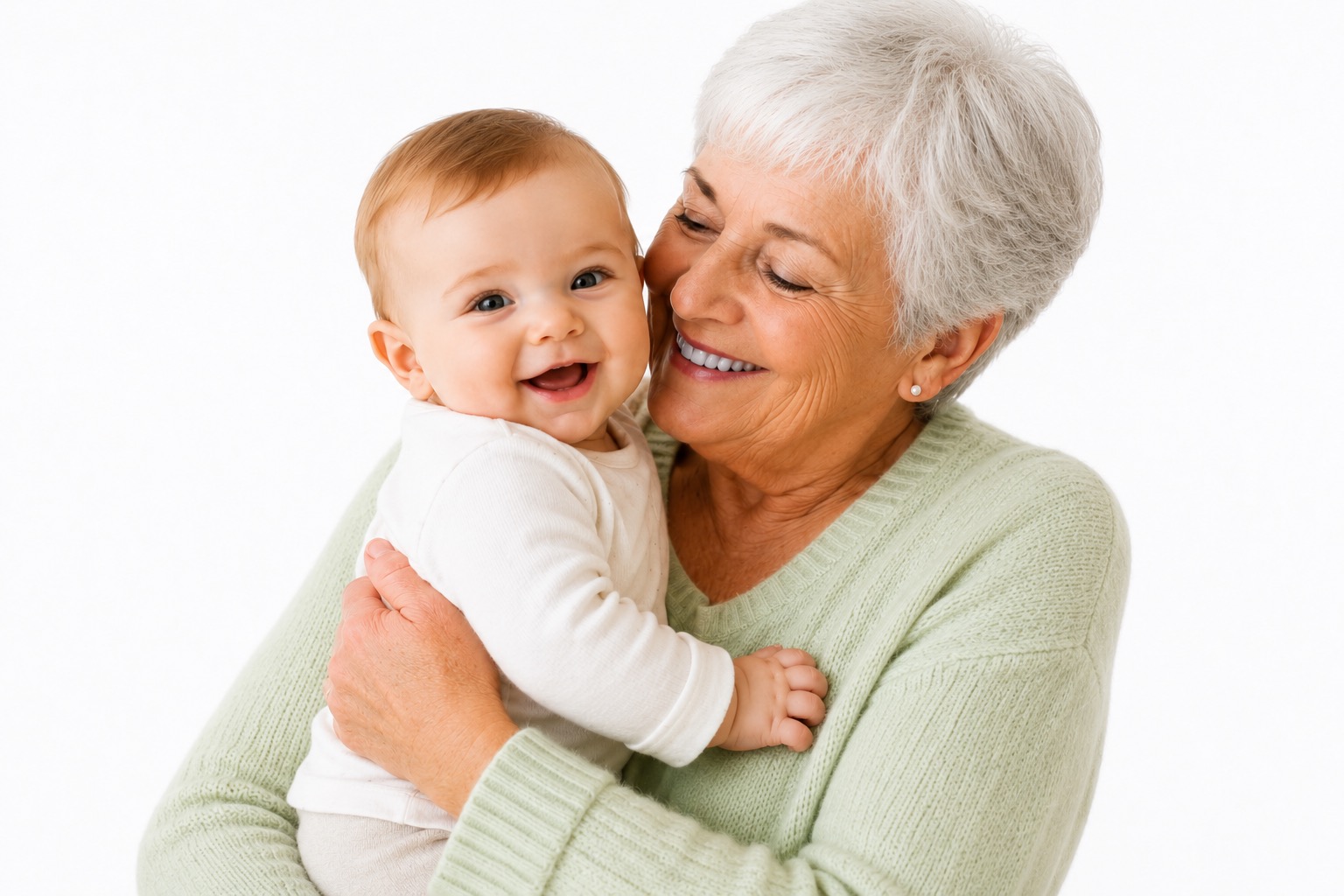 Smiling grandmother holding a happy baby after settling into a new home